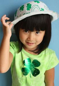 A small girl showing her hat