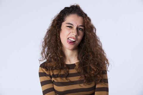 A women making a disgusting felling face