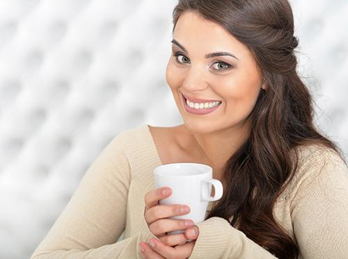 A women drinking coffee