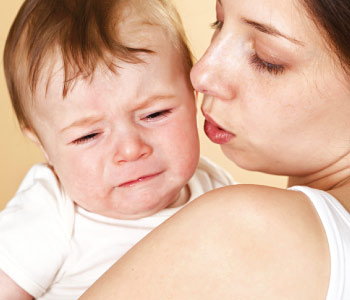 A Women holding a baby